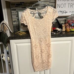 Baby pink short sleeve lace dress with open back